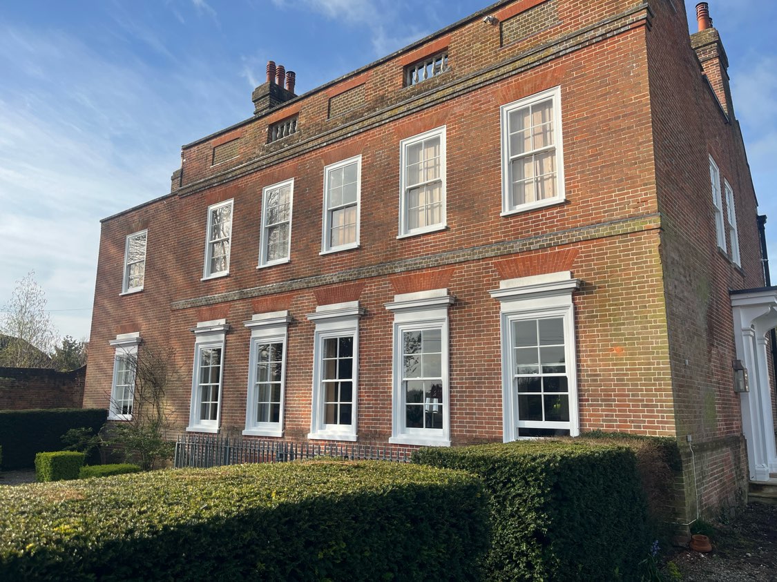 Restored Georgian-style timber windows on heritage home in Hampshire